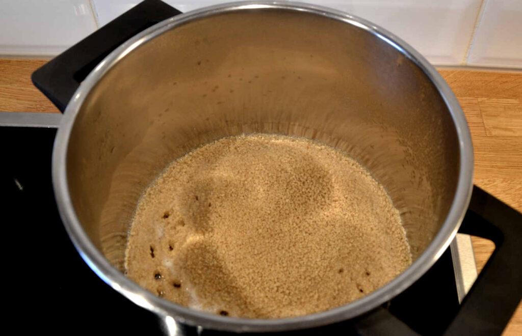 The pot with couscous when it just started cooking.