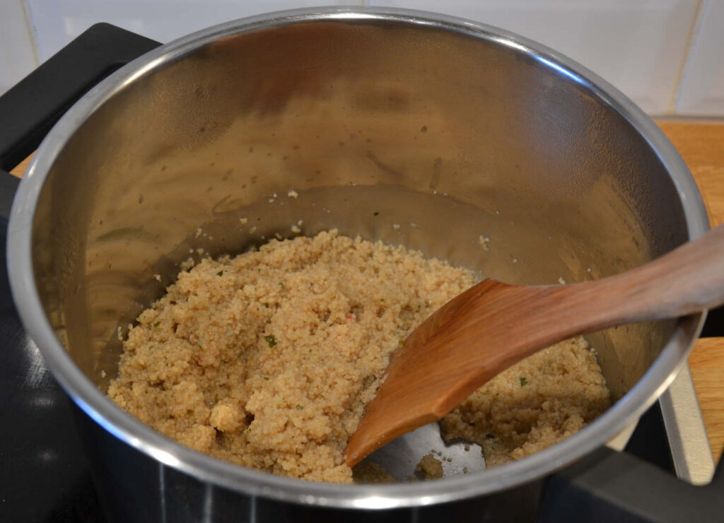 The pot with couscous when it finished cooking.