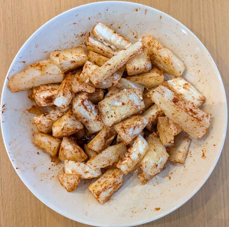 A plate of boiled and seasoned bits of Cassava root.